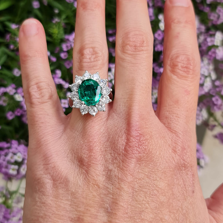 emerald ring with natural diamond around white gold