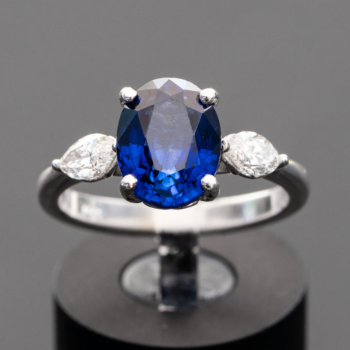 blue oval sapphire with 2 marquise cut diamonds