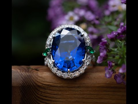 Juliana - 25.00 ct oval sapphire ring with 0.30 natural green emeralds and 1.10 carat natural diamonds